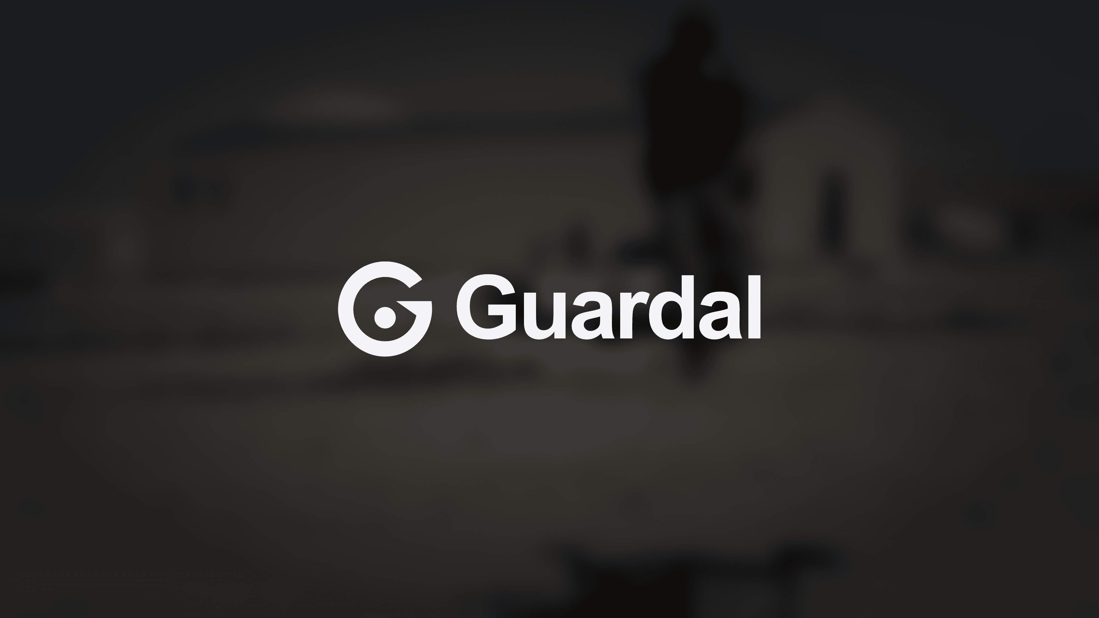 The Guardal logo over a blurred and darkened field photo